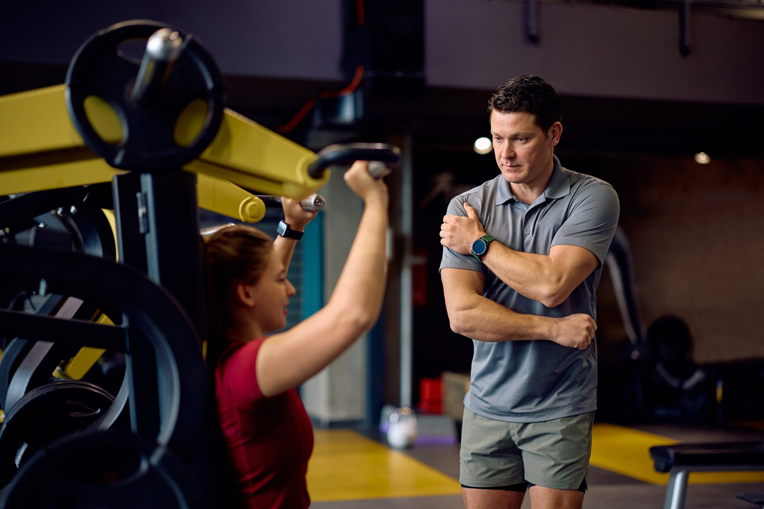 personal-trainer-assisting-sports